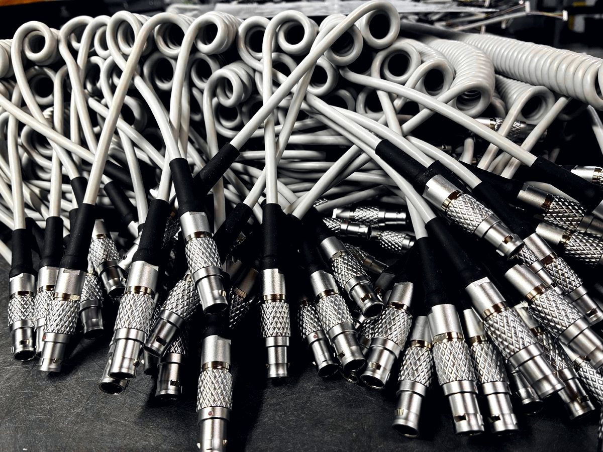Coiled conduit and knurled connectors
